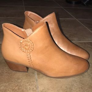 brown, leather zip-up booties with detail on side